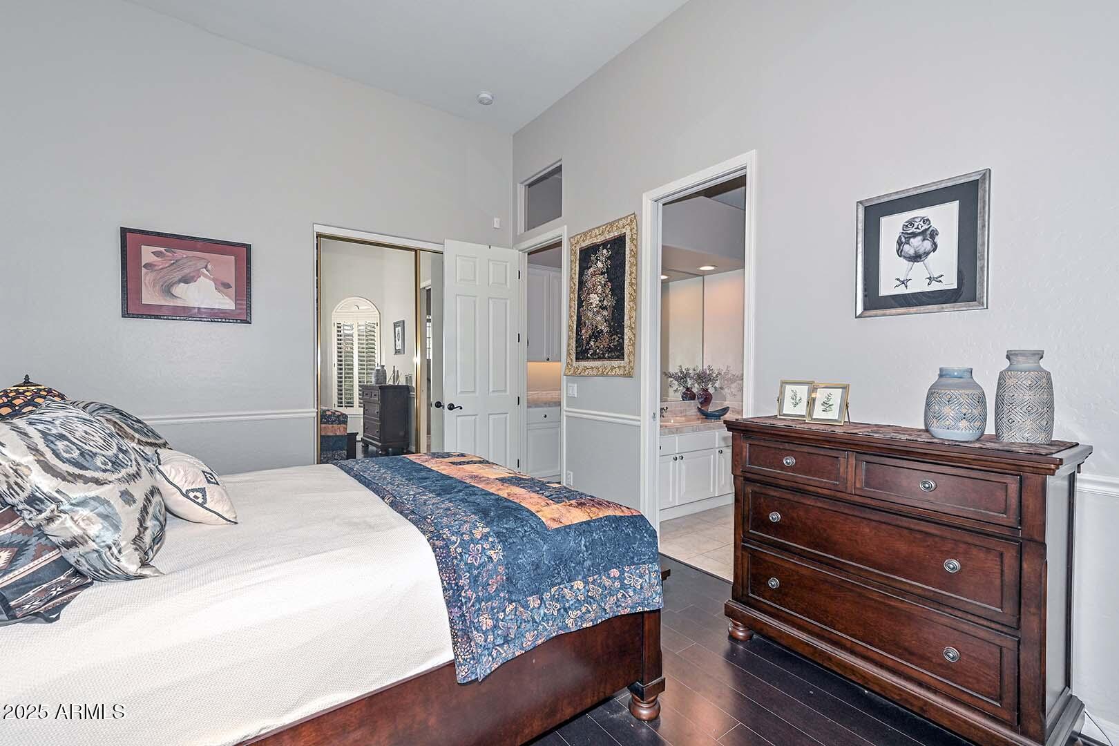 8540 East McDowell Road, Unit 55 Mesa, AZ 85207 - Photo 54 of 111 a bedroom with a bed and a dresser