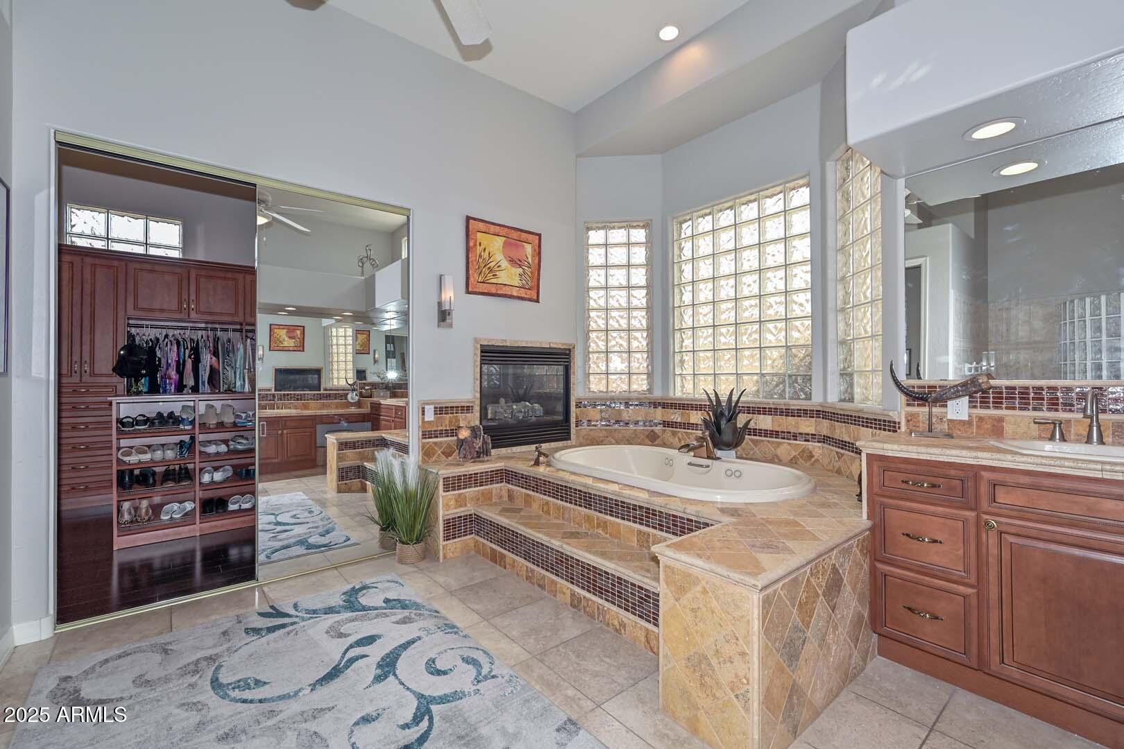 8540 East McDowell Road, Unit 55 Mesa, AZ 85207 - Photo 61 of 111 a spacious bathroom with a granite countertop sink and a mirror