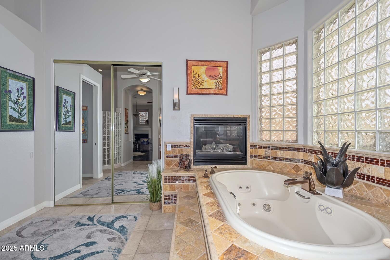 8540 East McDowell Road, Unit 55 Mesa, AZ 85207 - Photo 64 of 111 a spacious bathroom with a bathtub and sink