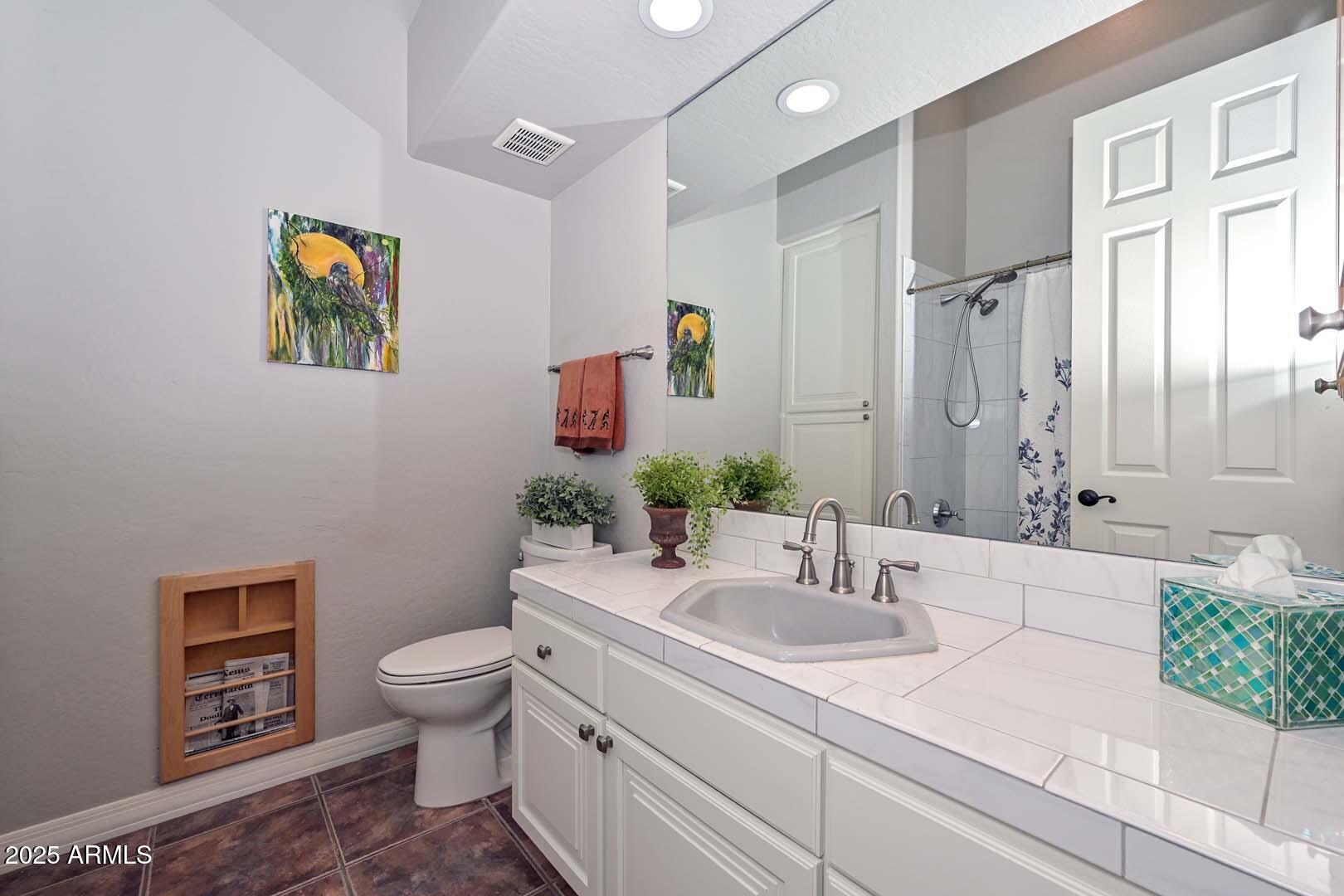 8540 East McDowell Road, Unit 55 Mesa, AZ 85207 - Photo 68 of 111 a bathroom with a granite countertop sink mirror vanity and toilet