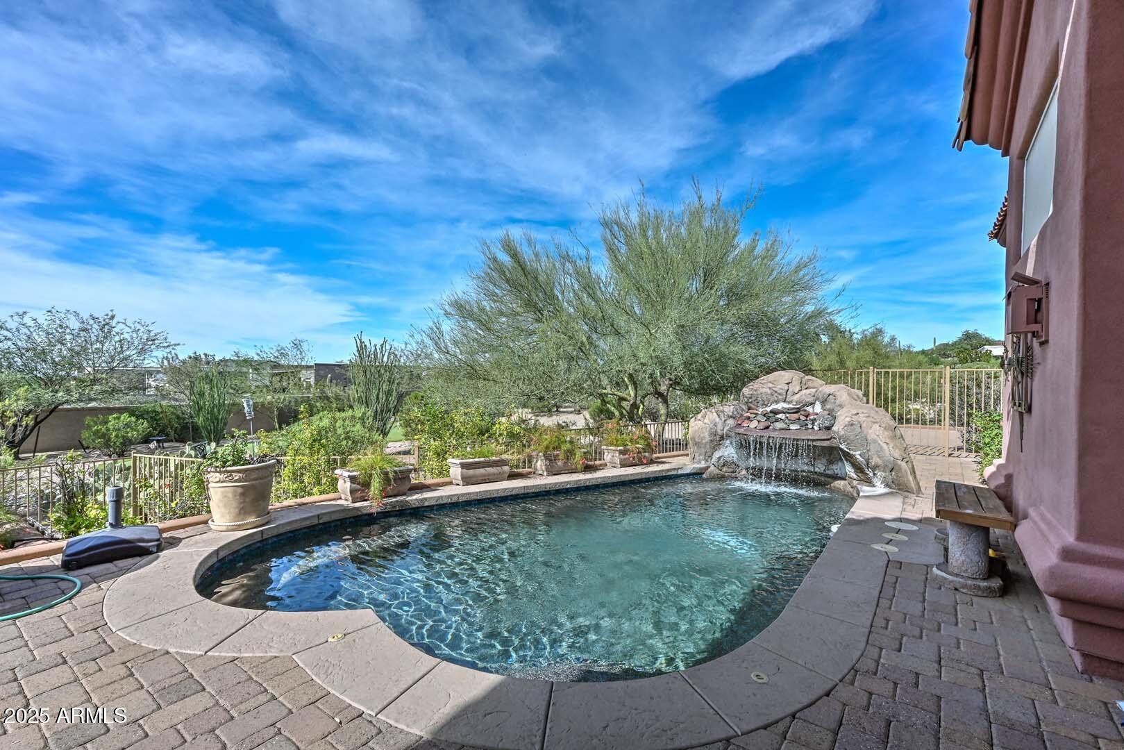 8540 East McDowell Road, Unit 55 Mesa, AZ 85207 - Photo 73 of 111 a view of a swimming pool with a patio