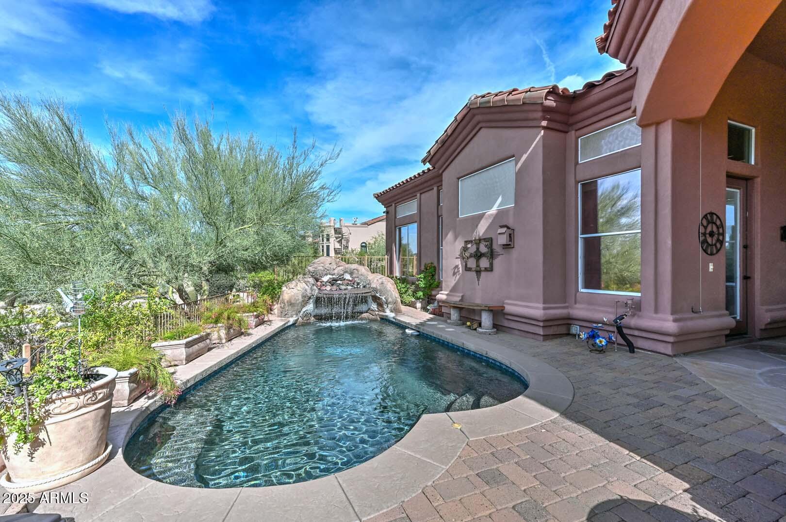 8540 East McDowell Road, Unit 55 Mesa, AZ 85207 - Photo 74 of 111 a view of a house with a small yard
