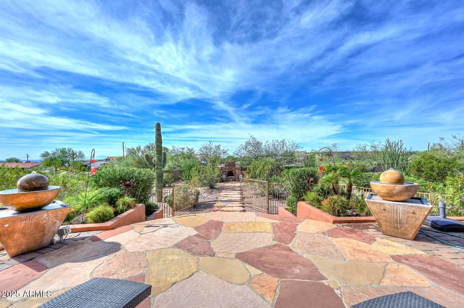 8540 East McDowell Road, Unit 55 Mesa, AZ 85207 - Photo 81 of 111 a view of a terrace with furniture