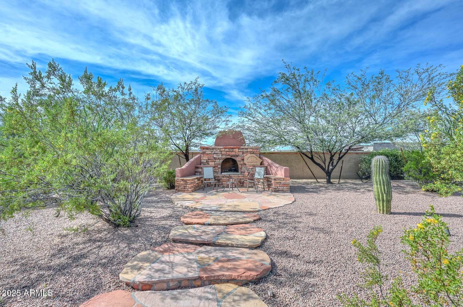 8540 East McDowell Road, Unit 55 Mesa, AZ 85207 - Photo 84 of 111 a view of a house with a yard