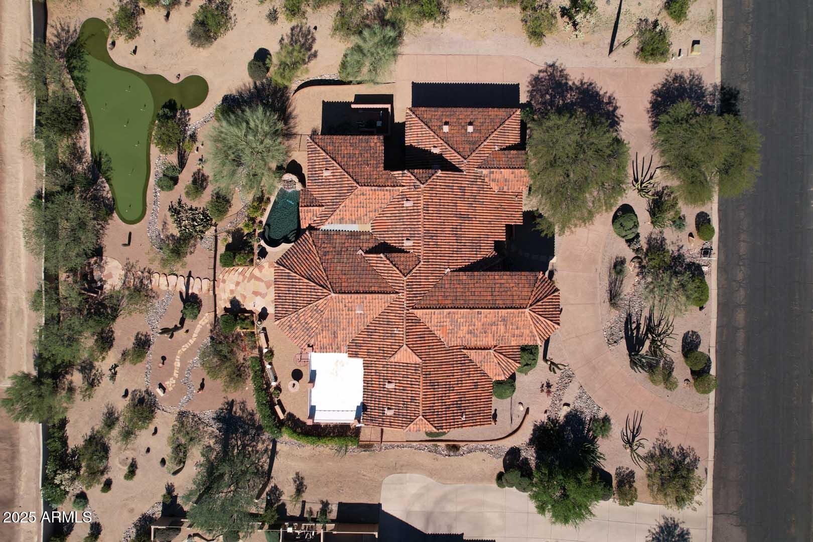8540 East McDowell Road, Unit 55 Mesa, AZ 85207 - Photo 98 of 111 an aerial view of residential houses with outdoor space