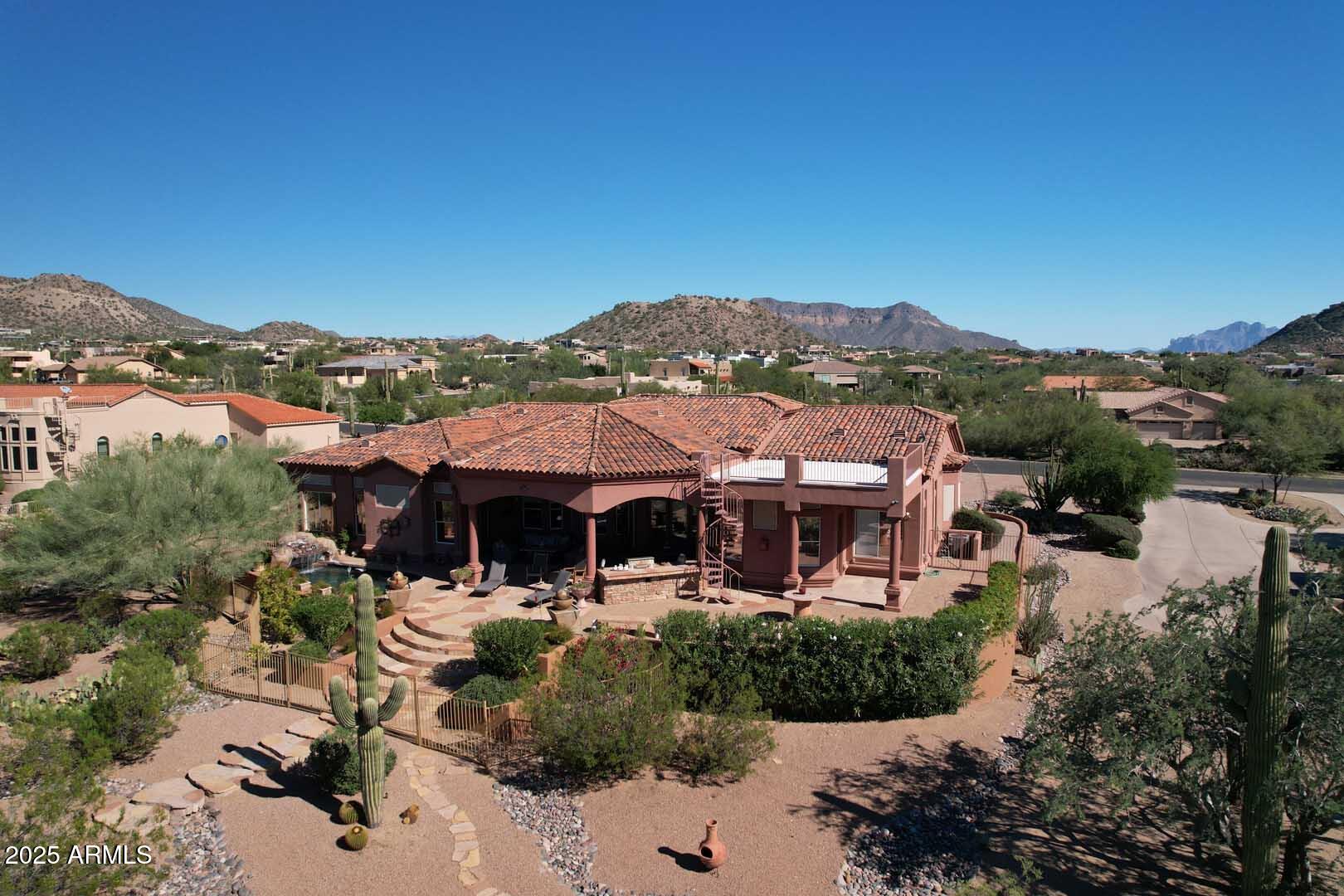 8540 East McDowell Road, Unit 55 Mesa, AZ 85207 - Photo 100 of 111 a view of a patio with couches under an umbrella