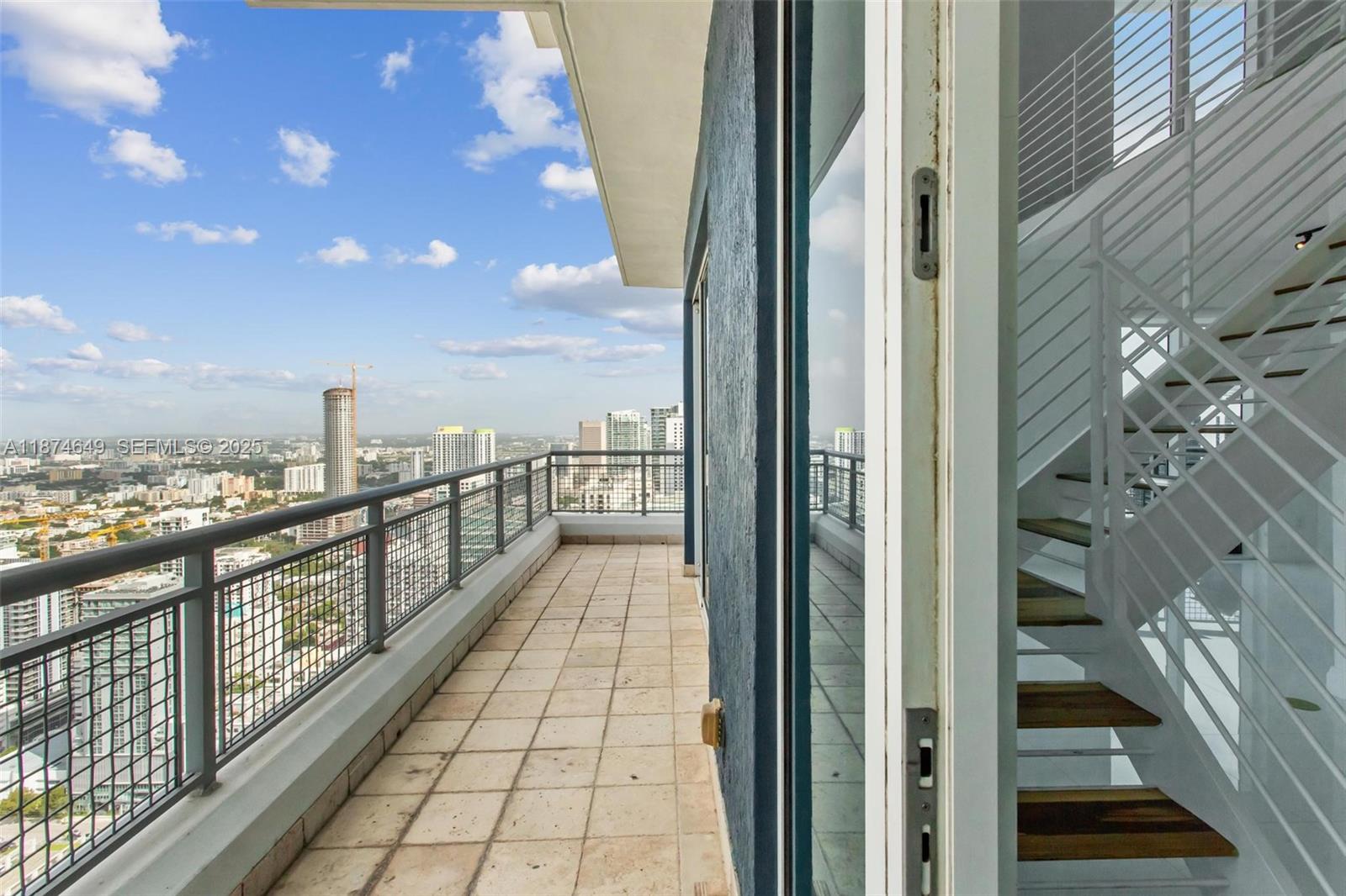 60 Southwest 13th Street, Unit 4413 Miami, FL 33130 - Photo 23 of 41 a view of a balcony with city view