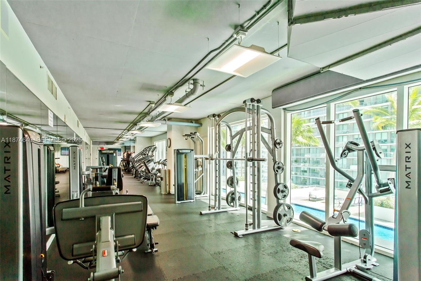 60 Southwest 13th Street, Unit 4413 Miami, FL 33130 - Photo 34 of 41 a view of a room with gym equipment