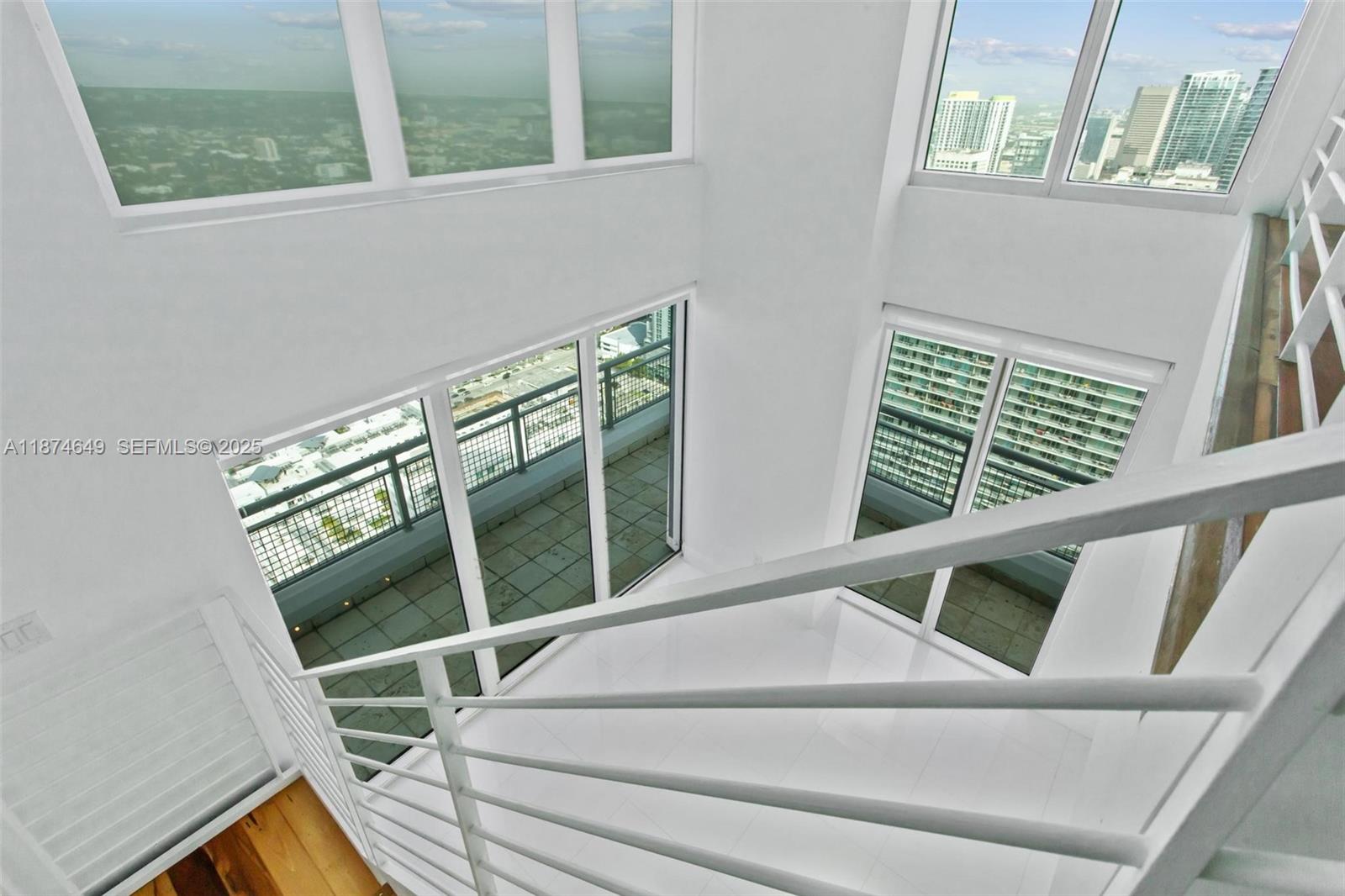 60 Southwest 13th Street, Unit 4413 Miami, FL 33130 - Photo 9 of 41 a view of deck with furniture and windows