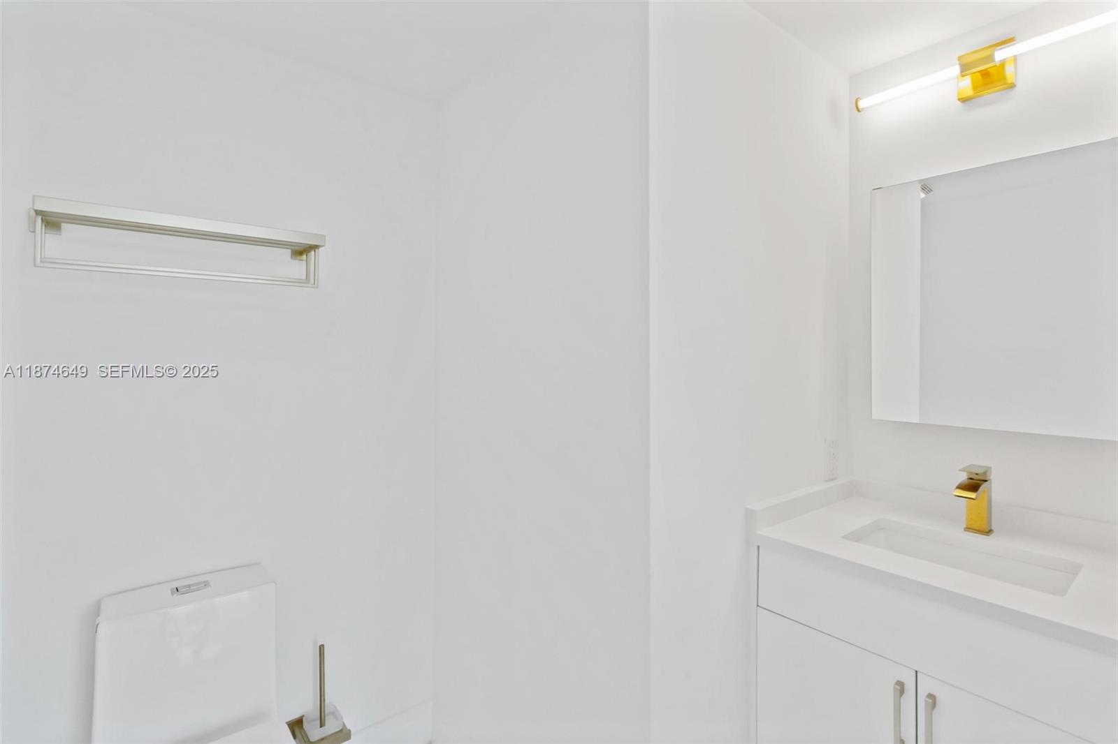 60 Southwest 13th Street, Unit 4413 Miami, FL 33130 - Photo 10 of 41 a bathroom with a shower and a sink