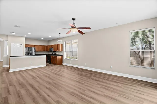 a view of a kitchen with a sink and a window
