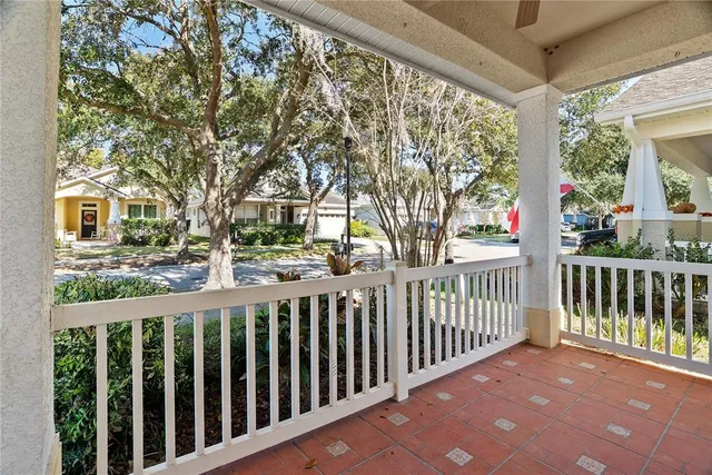 a view of a street with wooden fence