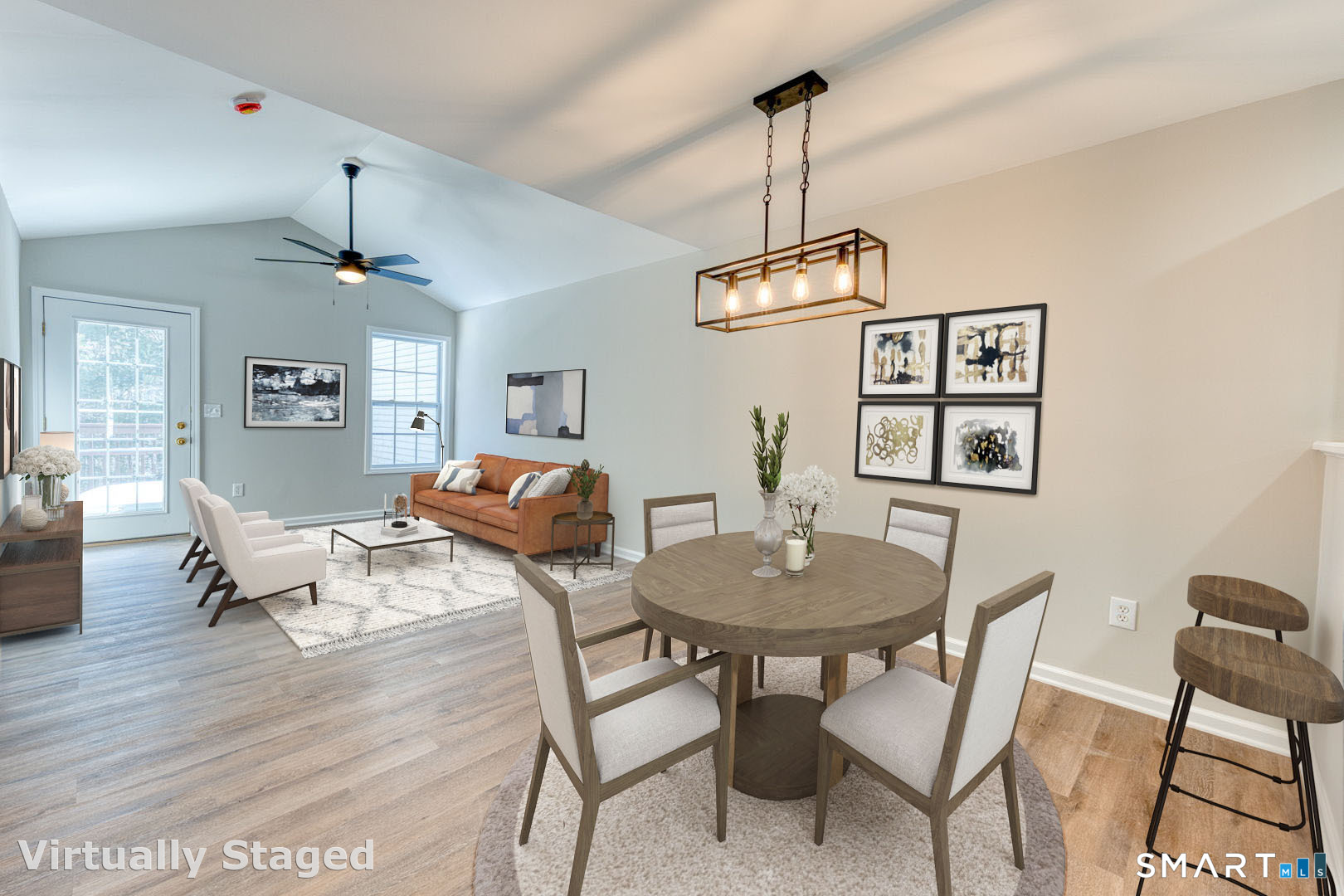 159 Jennifer Lane, Unit 159 Newtown, CT 06482 - Photo 3 of 28 a dining room with furniture a chandelier and wooden floor