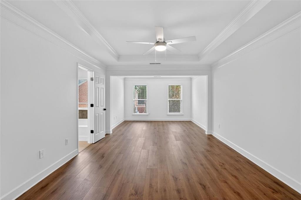 3267 Ferncliff Lane Atlanta, GA 30324 - Photo 12 of 25 a view of an empty room with wooden floor and a window