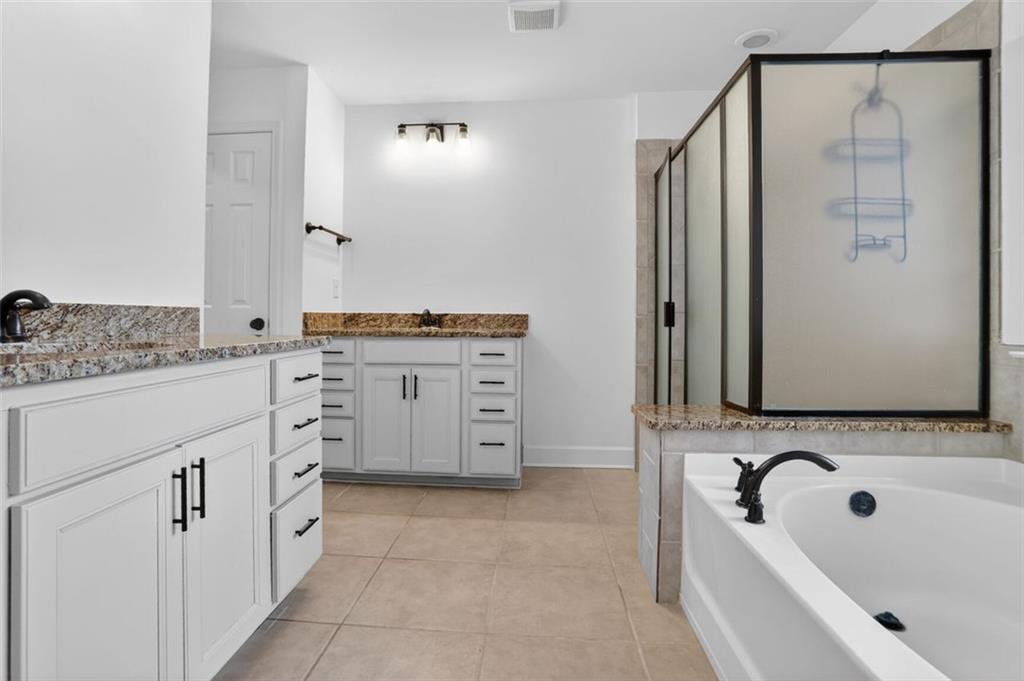 3267 Ferncliff Lane Atlanta, GA 30324 - Photo 15 of 25 a bathroom with a granite countertop sink and a mirror