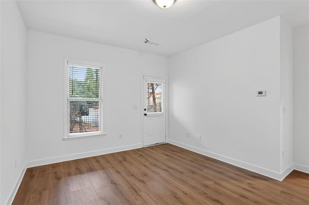 3267 Ferncliff Lane Atlanta, GA 30324 - Photo 22 of 25 an empty room with wooden floor and windows