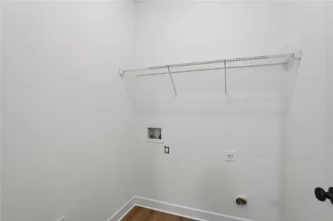 a bathroom with a granite countertop toilet sink and mirror