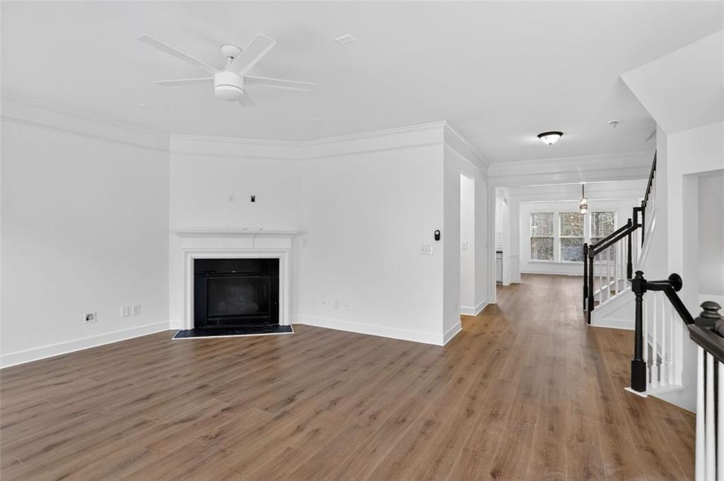 3267 Ferncliff Lane Atlanta, GA 30324 - Photo 4 of 25 a view of empty room with wooden floor and fan
