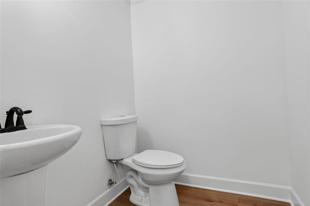 3267 Ferncliff Lane Atlanta, GA 30324 - Photo 10 of 25 a white toilet sitting next to a white sink