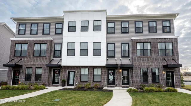 a view of a brick building with a yard