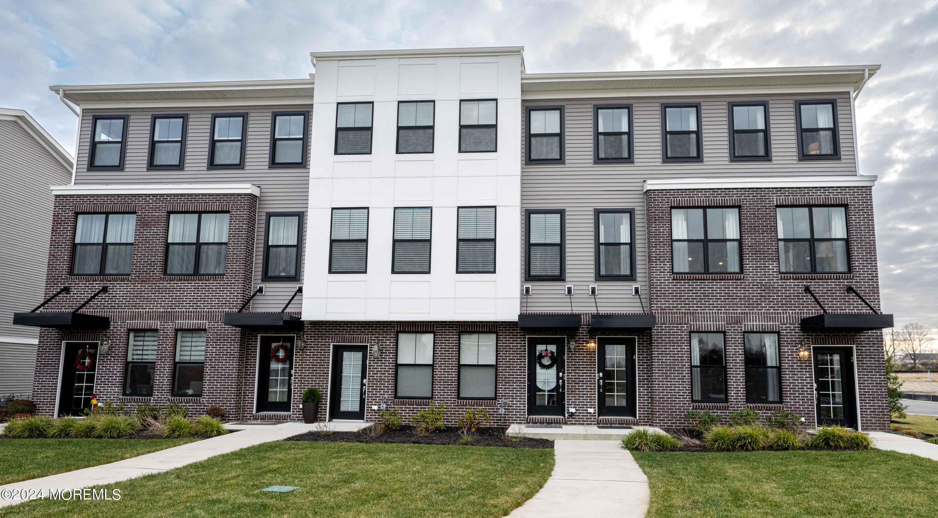 4 Midway Road South Tinton Falls, NJ 07724 - Photo 1 of 19 a view of a brick building with a yard
