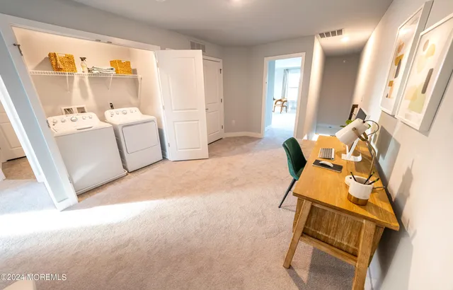 a spacious bathroom with a toilet sink and shower
