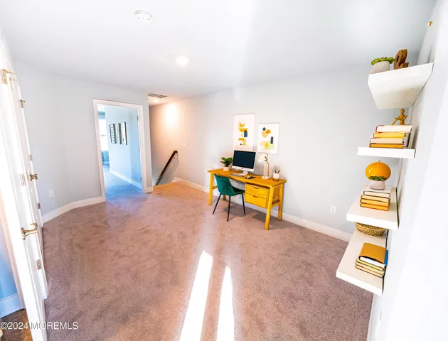 a workspace with furniture and a window