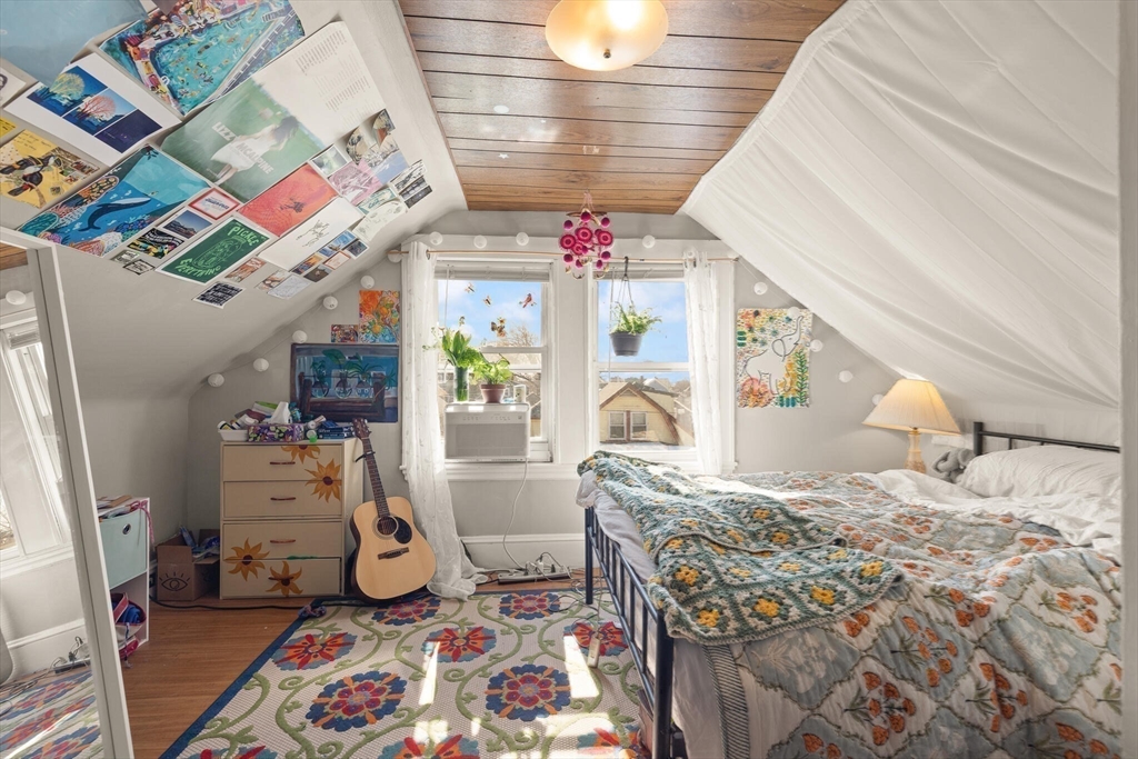 25-27 Upland Road Somerville, MA 02144 - Photo 15 of 38 a bed room with a bed and a window