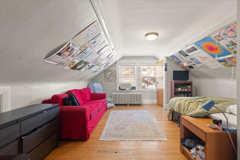 25-27 Upland Road Somerville, MA 02144 - Photo 17 of 38 a living room with furniture