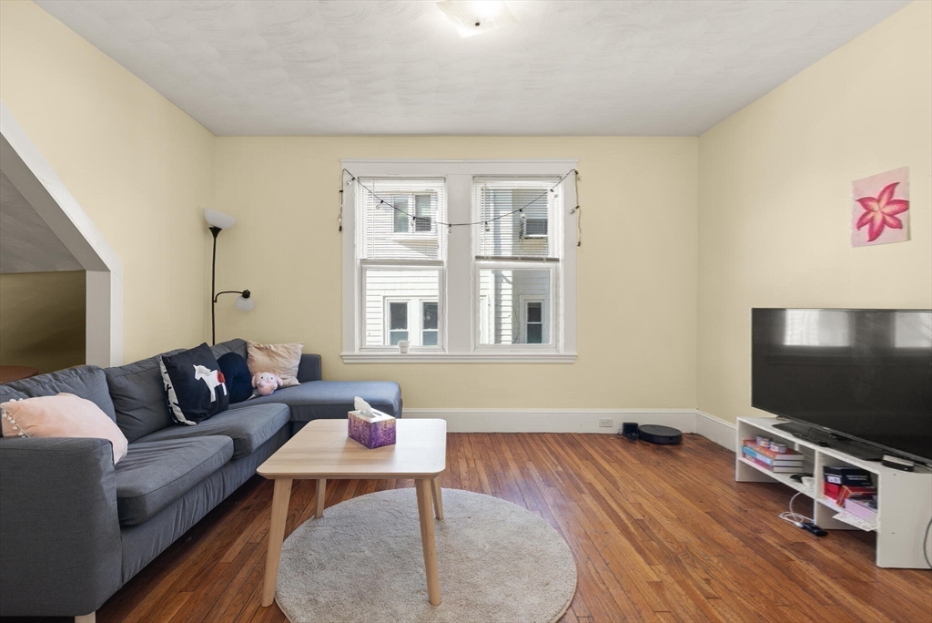 25-27 Upland Road Somerville, MA 02144 - Photo 22 of 38 a living room with furniture and a flat screen tv