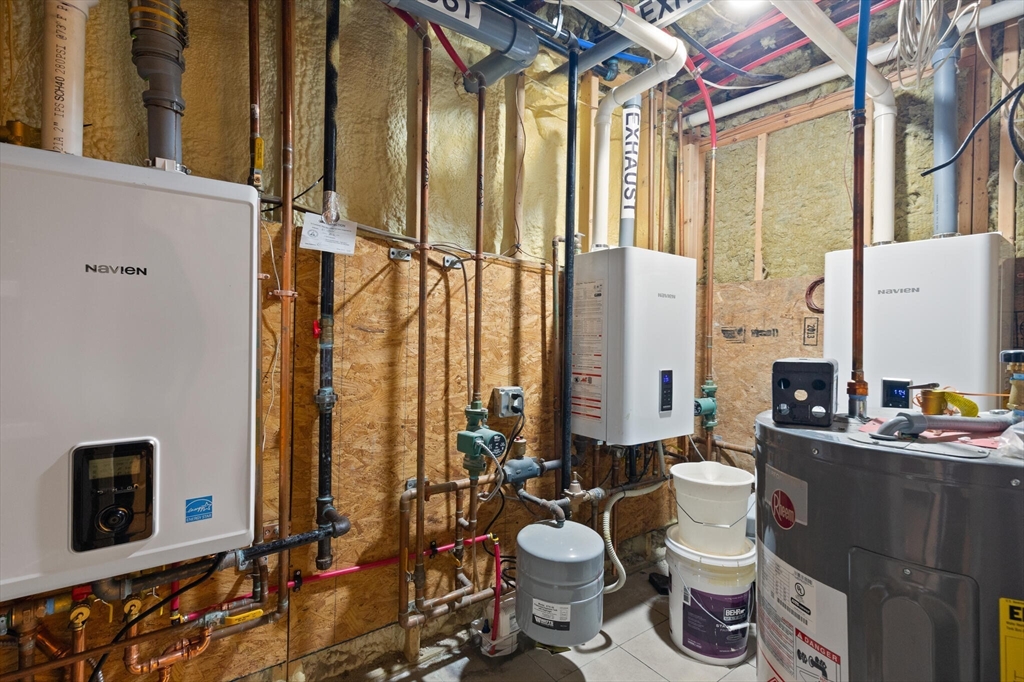 25-27 Upland Road Somerville, MA 02144 - Photo 35 of 38 a bathroom with a toilet a sink and a mirror
