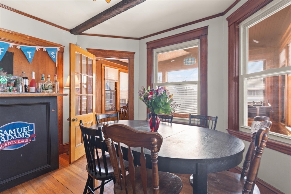 25-27 Upland Road Somerville, MA 02144 - Photo 4 of 38 a view of a dining room with furniture window and outside view