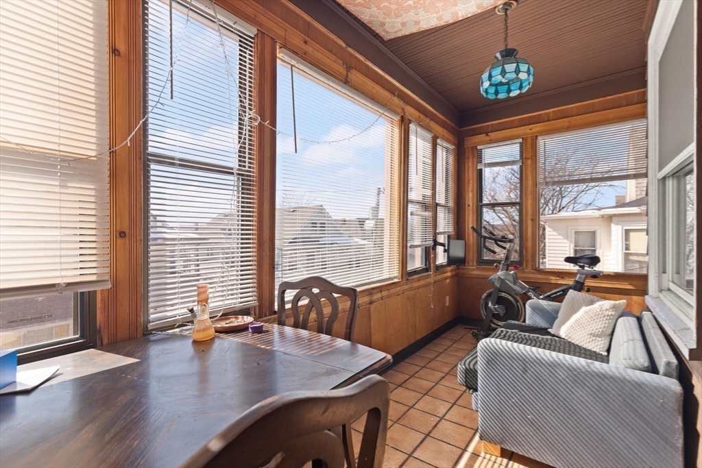 25-27 Upland Road Somerville, MA 02144 - Photo 5 of 38 a living room with furniture and floor to ceiling windows