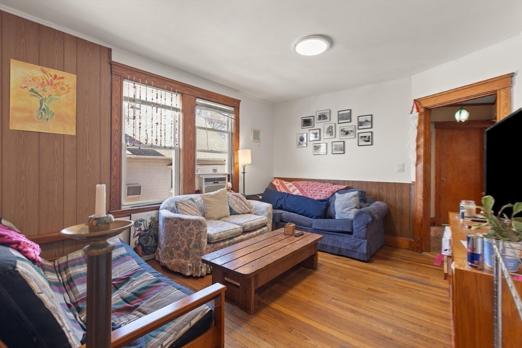 25-27 Upland Road Somerville, MA 02144 - Photo 6 of 38 a living room with furniture and a window