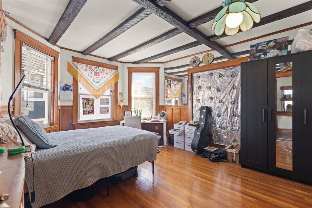 25-27 Upland Road Somerville, MA 02144 - Photo 9 of 38 a bedroom with furniture and large windows
