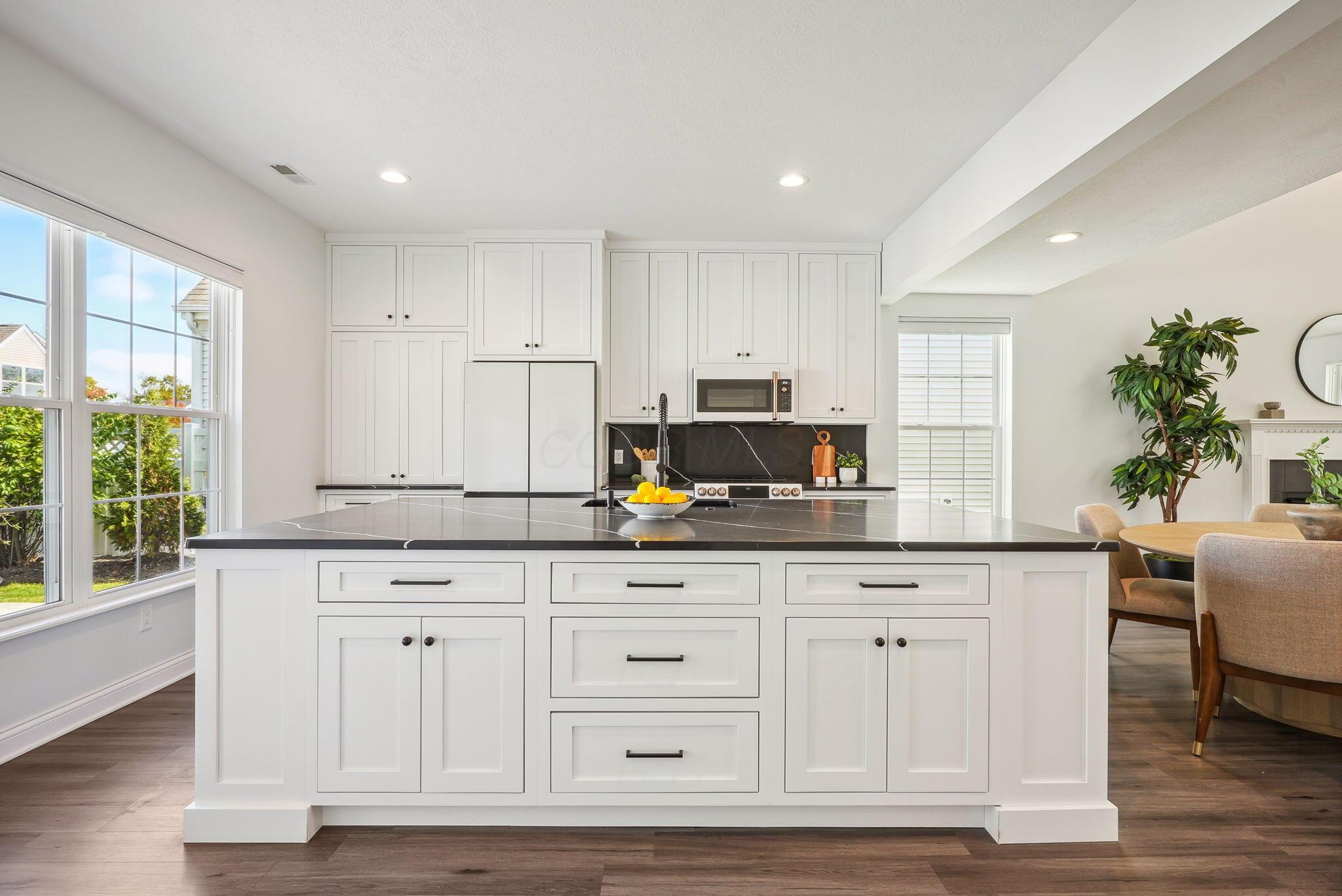 5990 Mealla Road Westerville, OH 43081 - Photo 9 of 36 The Island! Custom 9.5" x 5.5" island w/signature quartz countertops. Spectacular.