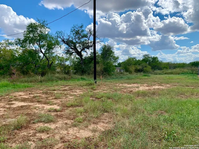 a view of outdoor space with deck and yard