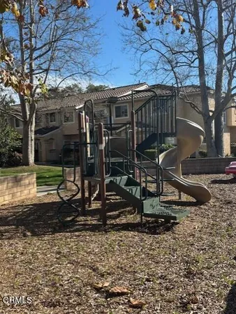 a view of a backyard with sitting area