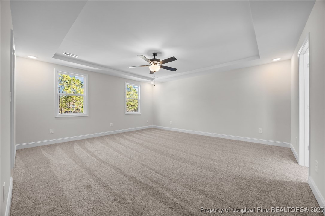 785 Quewhiffle (lot 3) Road Aberdeen, NC 28315 - Photo 28 of 50 an empty room with windows and ceiling fan