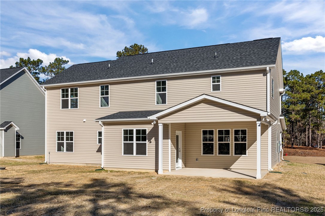 785 Quewhiffle (lot 3) Road Aberdeen, NC 28315 - Photo 41 of 50 a front view of a house with a yard