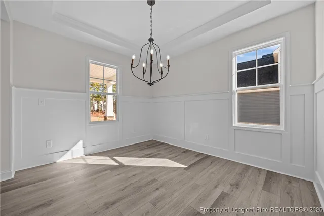 a kitchen with stainless steel appliances granite countertop a sink stove and wooden floor