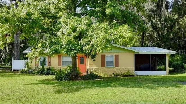 a view of a pathway with a yard