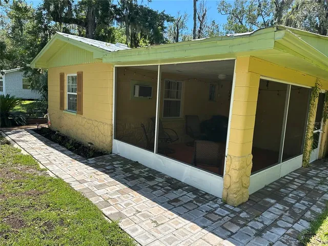 an aerial view of a houses with a yard