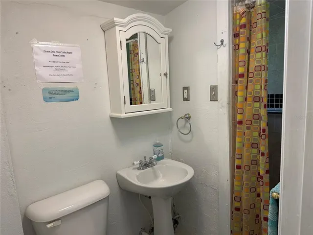 a view of a hallway with windows