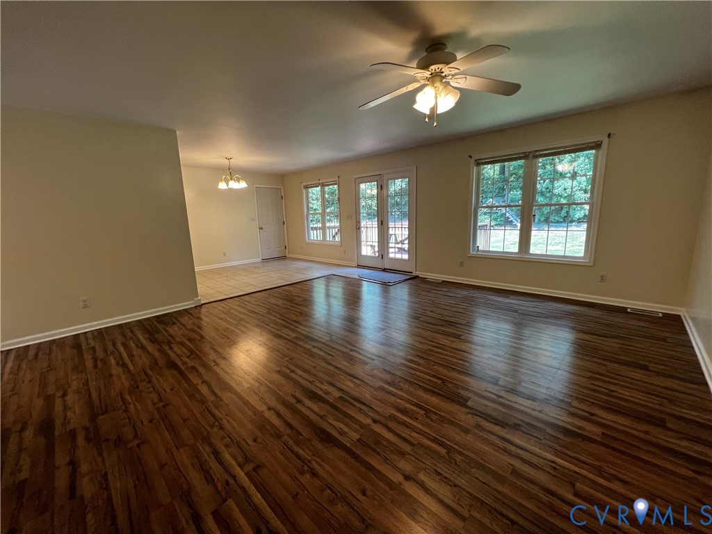 594 Landing Road Farmville, VA 23901 - Photo 3 of 21 a view of an empty room with window and wooden floor