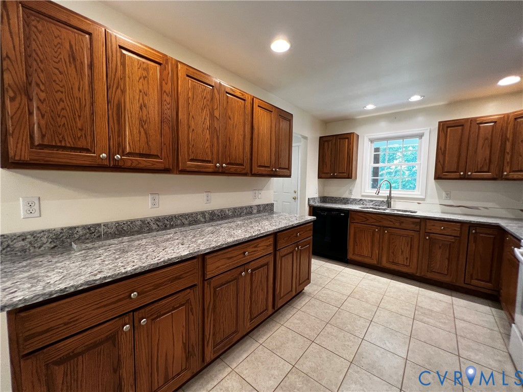 594 Landing Road Farmville, VA 23901 - Photo 8 of 21 a kitchen with stainless steel appliances granite countertop wooden cabinets a sink and dishwasher