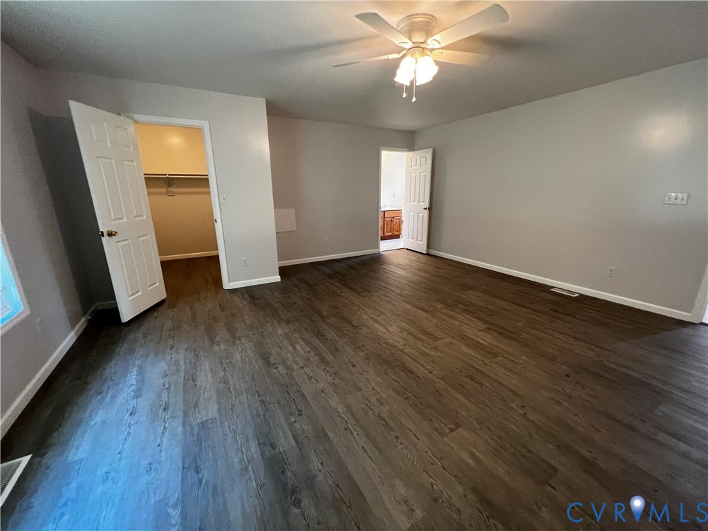 594 Landing Road Farmville, VA 23901 - Photo 10 of 21 wooden floor in an empty room with a window