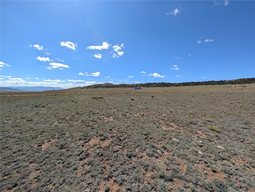 2895 Summit Road Hartsel, CO 80449 - Photo 9 of 13 a view of a pathway of a building next to a yard