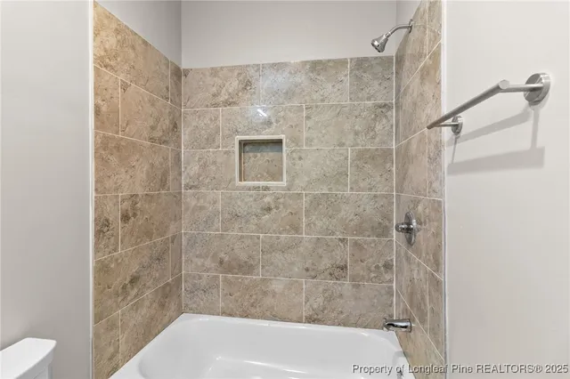 a bathroom with a shower and bathtub