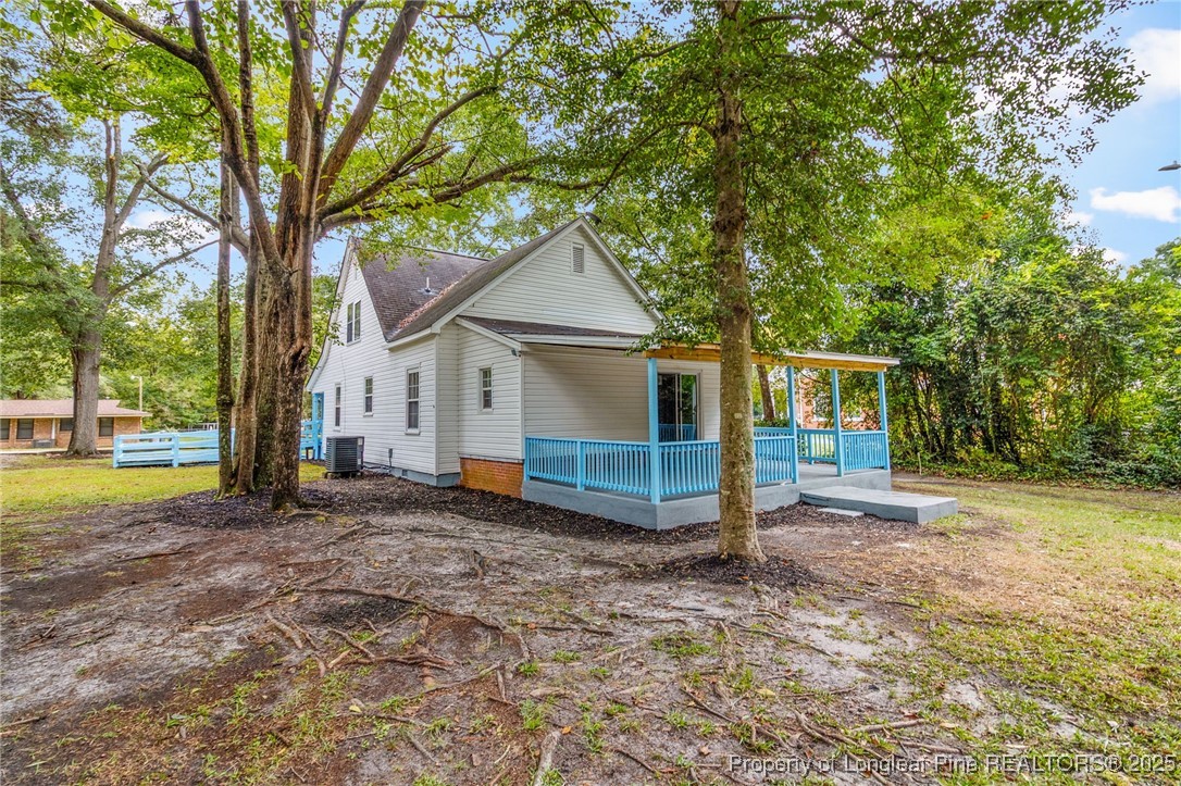 402 Morro Street Fairmont, NC 28340 - Photo 35 of 36 a view of a house with a yard and large tree